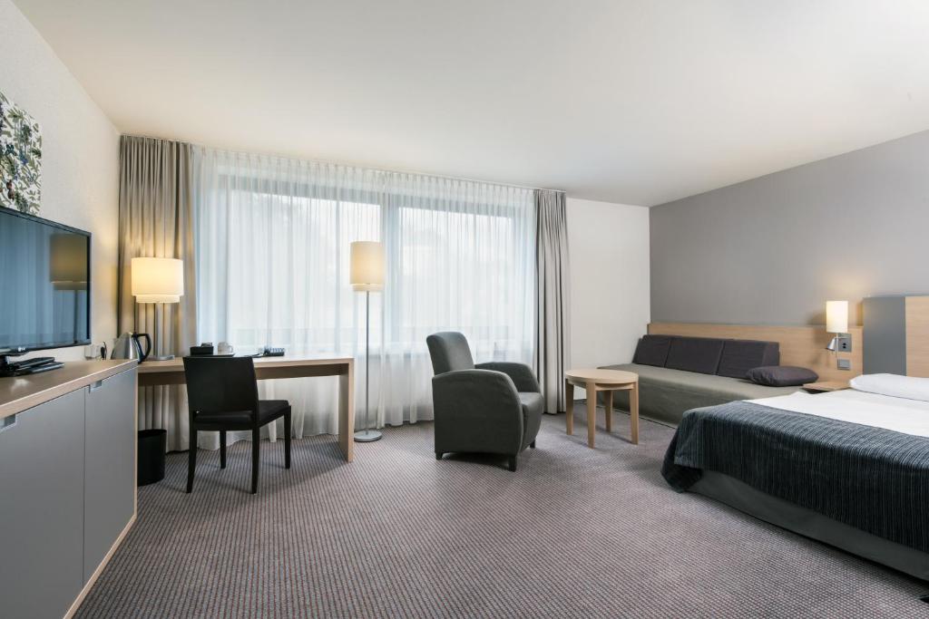 Postel nebo postele na pokoji v ubytování Mercure Hotel Düsseldorf Neuss