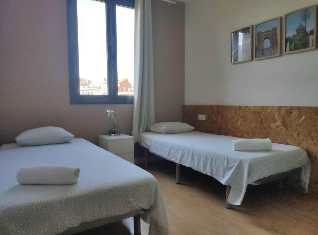 Posteľ alebo postele v izbe v ubytovaní Diagonal Apartments