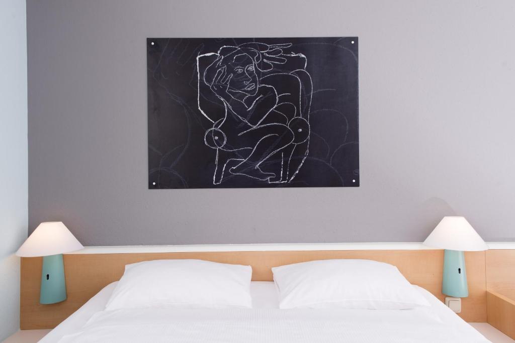 Postel nebo postele na pokoji v ubytování ibis Berlin City Nord