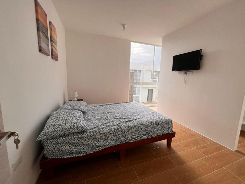 Ένα ή περισσότερα κρεβάτια σε δωμάτιο στο Punta blanca club y playa house 2