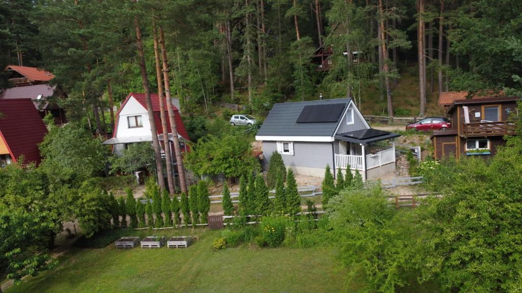 an aerial view of a house with a fence at Domki nad jeziorem Łąkowa in Gietrzwałd