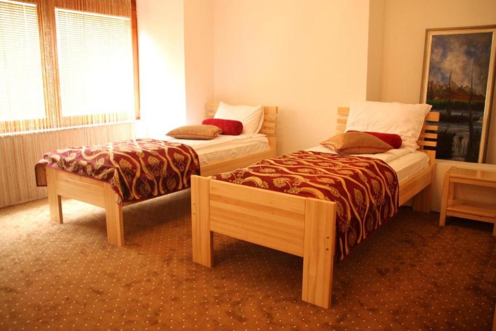 Postel nebo postele na pokoji v ubytování Hotel Berr