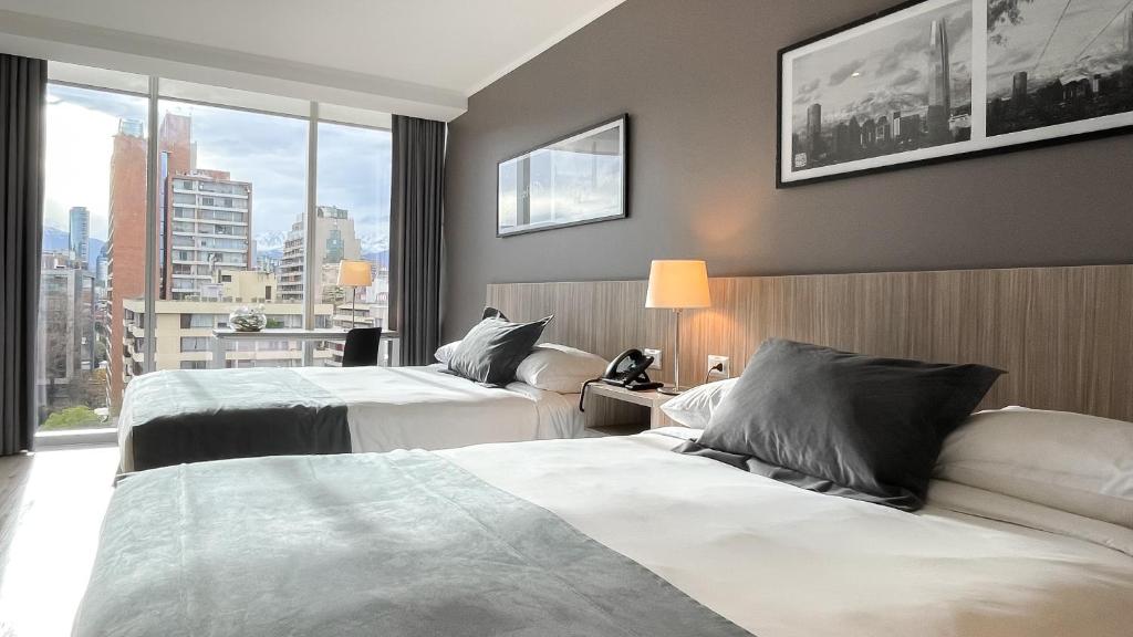 Postel nebo postele na pokoji v ubytování Hotel Capital Bellet