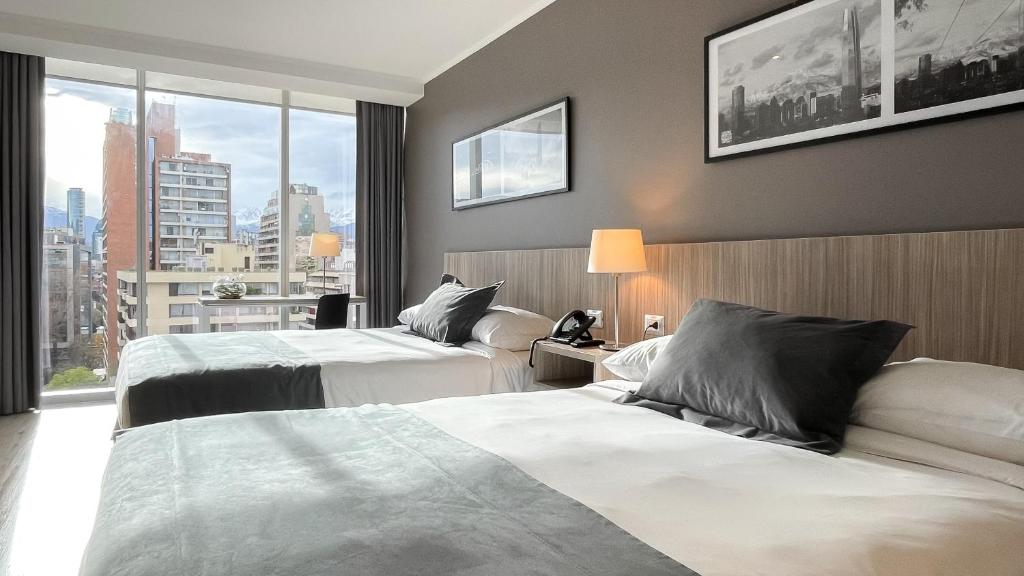 Postel nebo postele na pokoji v ubytování Hotel Capital Bellet