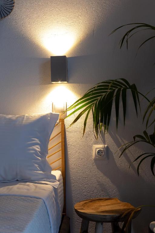 Postel nebo postele na pokoji v ubytování Divino Suites