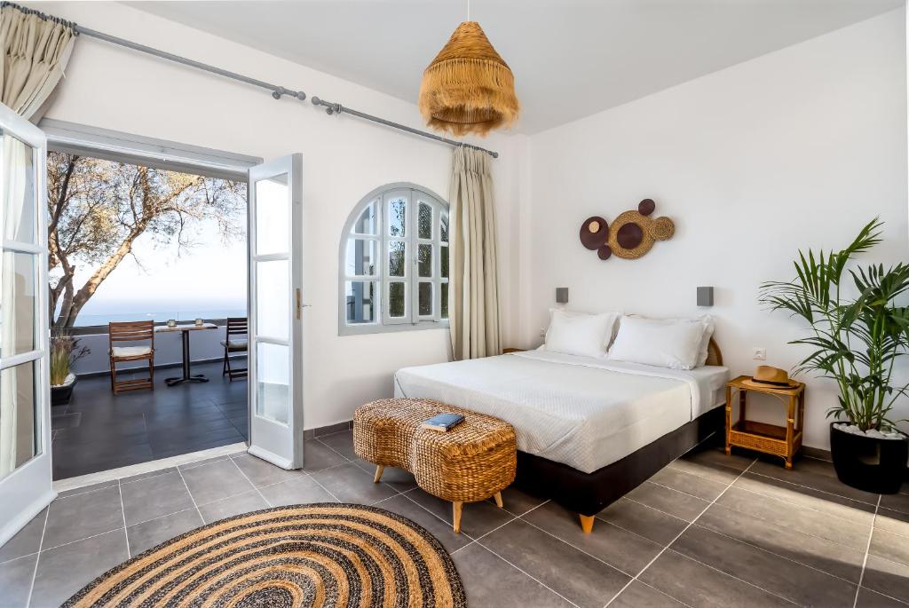 Postel nebo postele na pokoji v ubytování Divino Suites