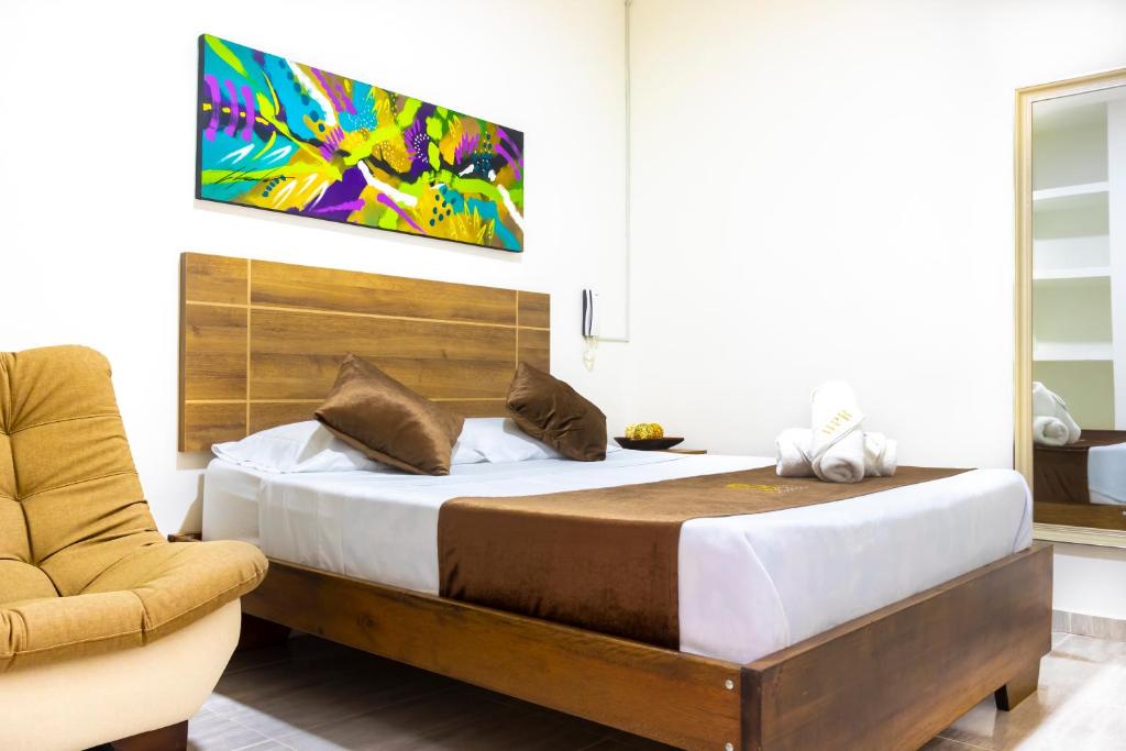 Postel nebo postele na pokoji v ubytování HOTEl PLAZA REAL