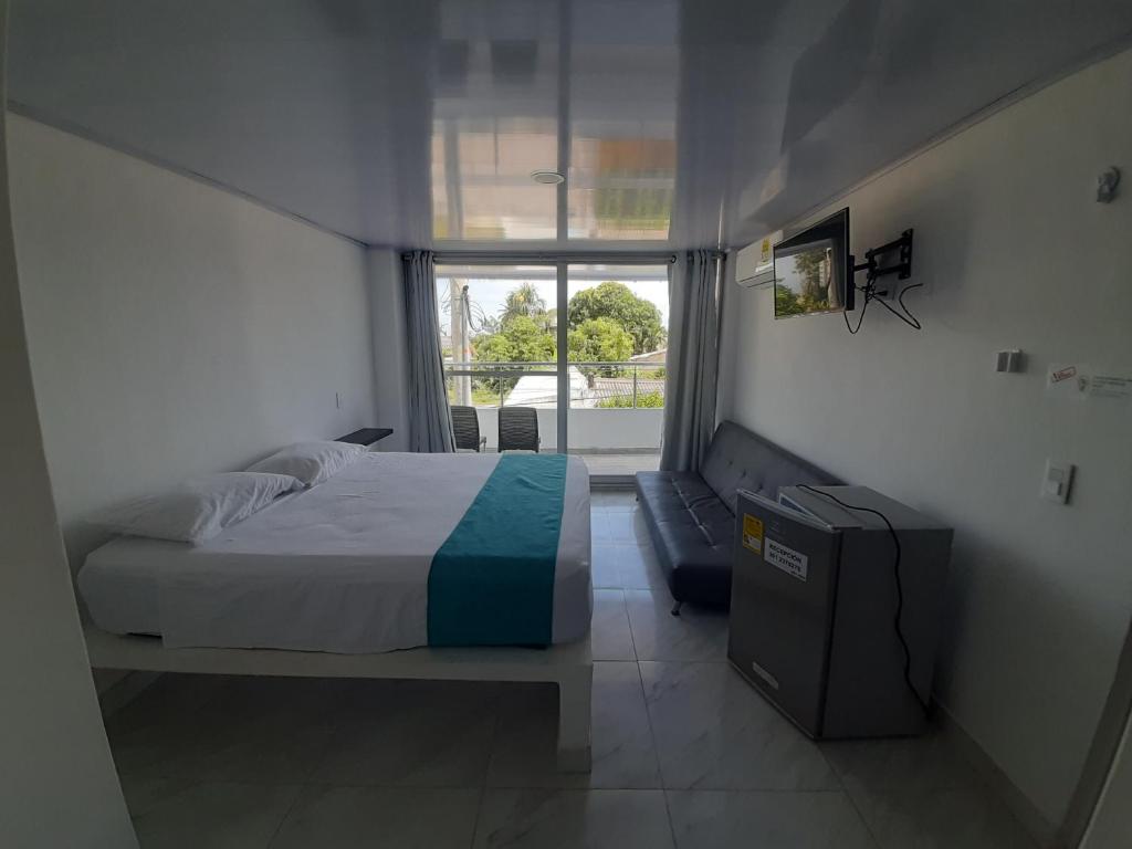 Postel nebo postele na pokoji v ubytování Sky view hotel tolu