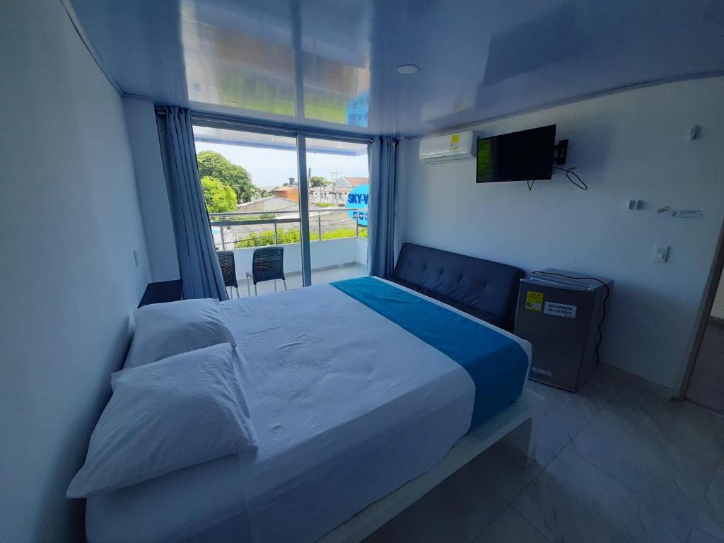 Postel nebo postele na pokoji v ubytování Sky view hotel tolu