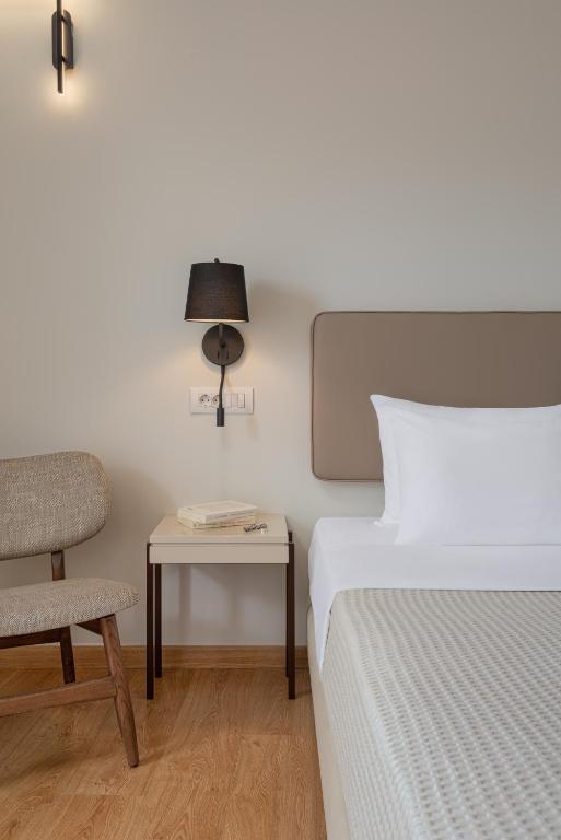 Postel nebo postele na pokoji v ubytování Preveza City Comfort Hotel