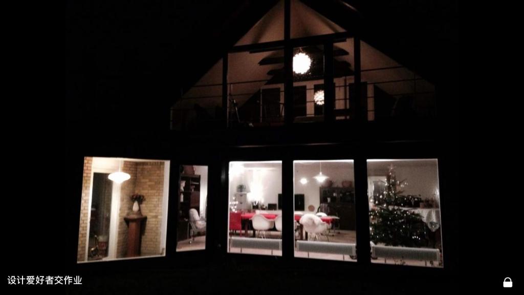 a view of a living room through a window at Quiet villa apartment close to everything in Odense