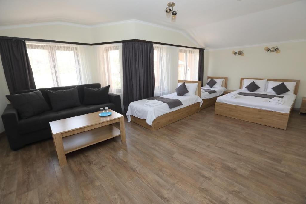 Postel nebo postele na pokoji v ubytování V.MOD Hotel