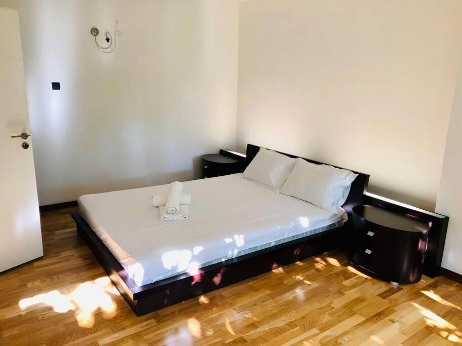 a bedroom with a bed with a phone on it at Joy City Stay George Enescu 12 in Timişoara