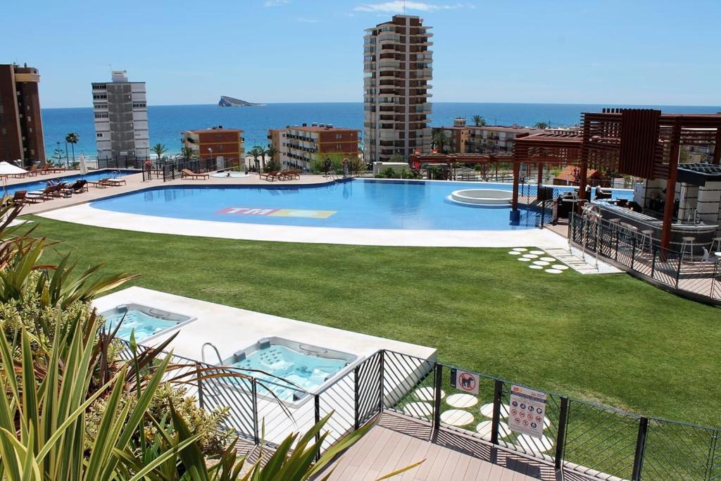 a large swimming pool on top of a building at Sunset Drive nice komplex on the beach Poniente in Benidorm