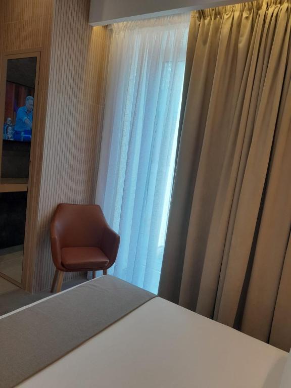 TV o dispositivi per l'intrattenimento presso BAARIA House Hotel
