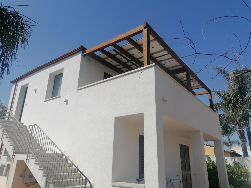 a white house with stairs on top of it at VILLA SOFIA in Marsala