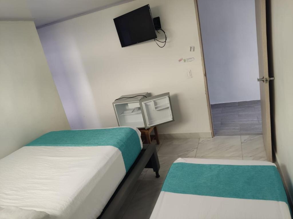 Postel nebo postele na pokoji v ubytování Sky view hotel tolu