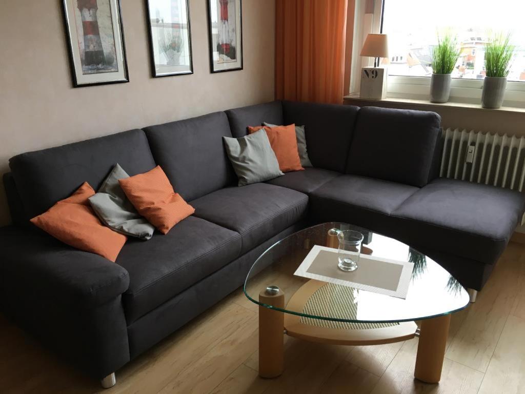 a living room with a couch and a table at Iderhoff Iderhoff 18 in Norderney