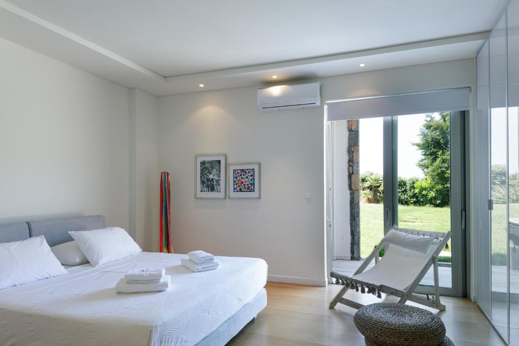 Postel nebo postele na pokoji v ubytování Villa Dei Sogni, for the Design Lovers,By ThinkVilla