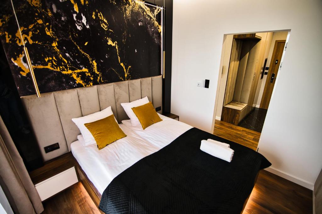 Łóżko lub łóżka w pokoju w obiekcie Boutique 78 by Housine