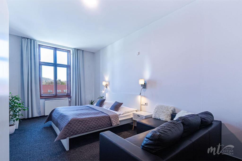 Ένα ή περισσότερα κρεβάτια σε δωμάτιο στο Hotel Centrum