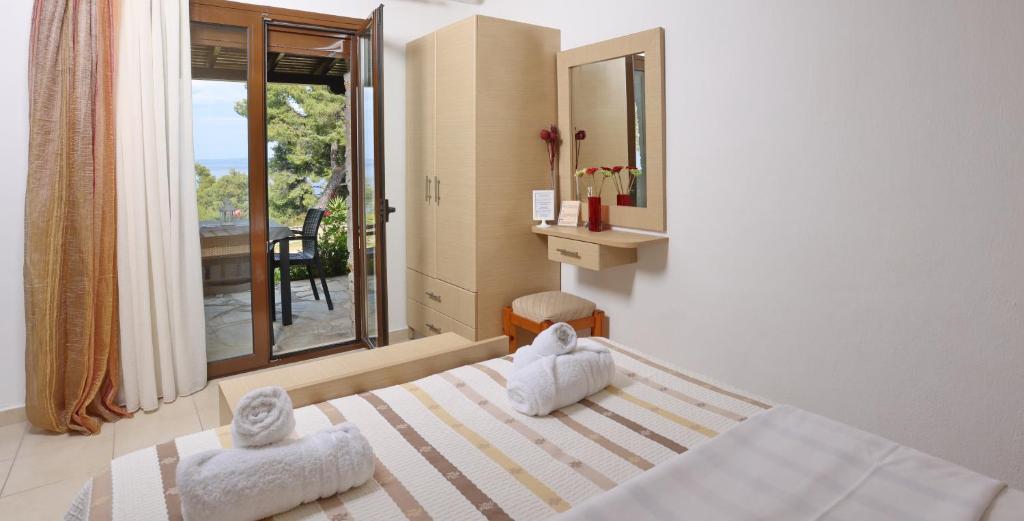 Posteľ alebo postele v izbe v ubytovaní Peristeridi Apartments