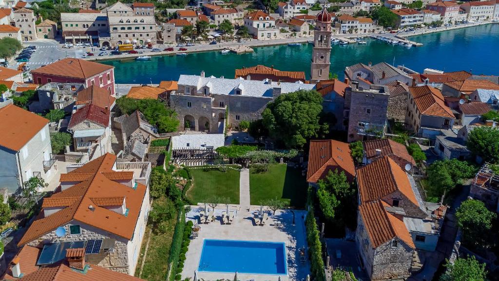 an aerial view of a town next to the water at Puteus Palace Heritage Hotel in Pučišća