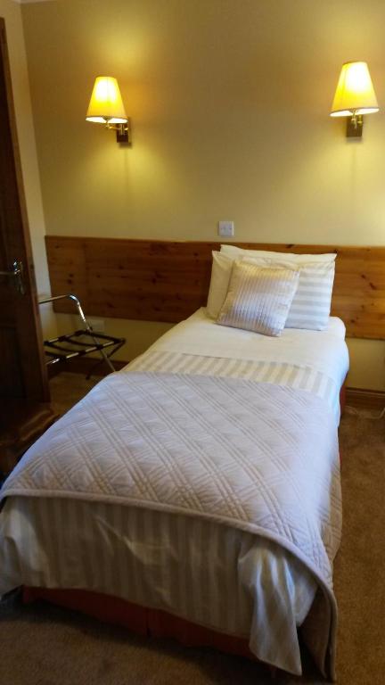 Postel nebo postele na pokoji v ubytování Ballyraine Guesthouse