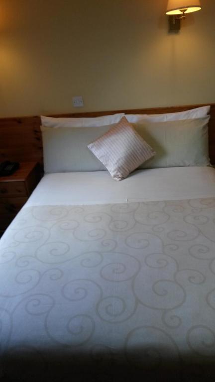 Postel nebo postele na pokoji v ubytování Ballyraine Guesthouse