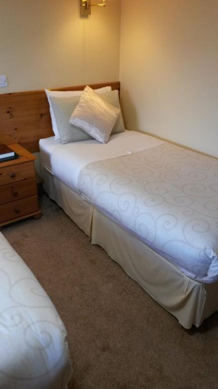 Postel nebo postele na pokoji v ubytování Ballyraine Guesthouse