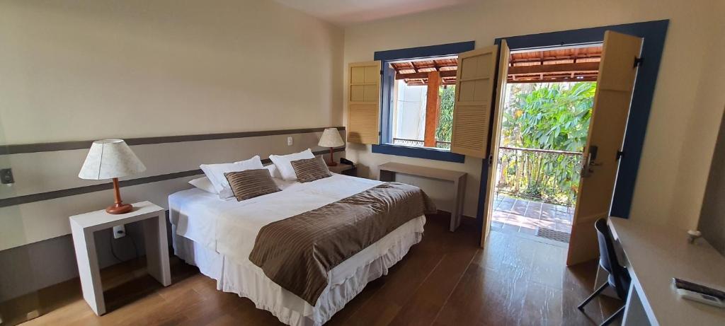 Postel nebo postele na pokoji v ubytování Pousada Villa Magnolia