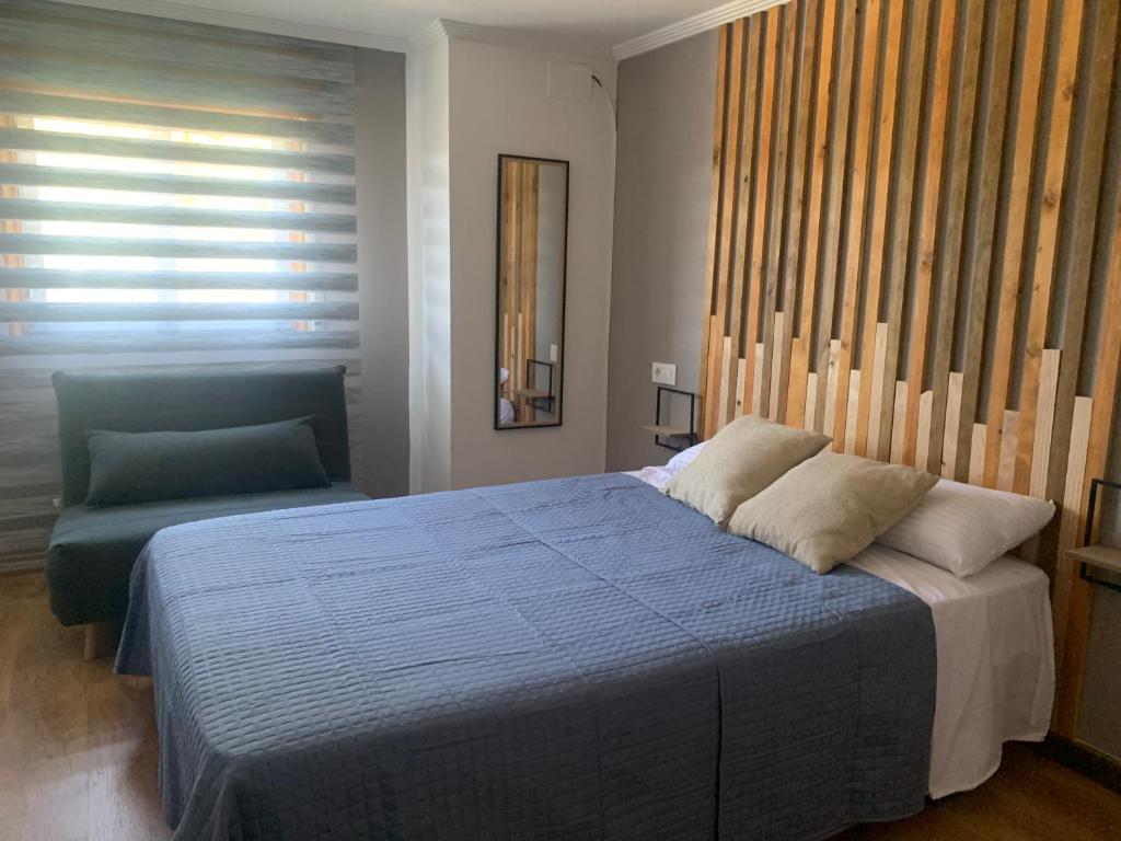 Posteľ alebo postele v izbe v ubytovaní Blue House - Feel The Vibe