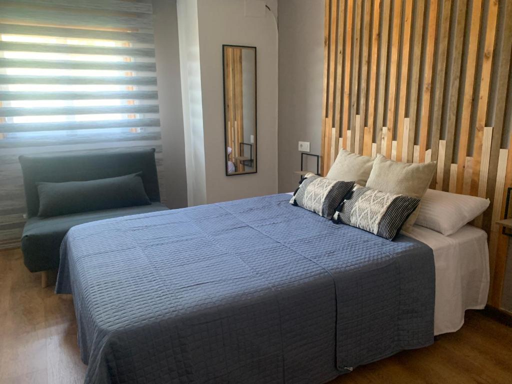 Posteľ alebo postele v izbe v ubytovaní Blue House - Feel The Vibe