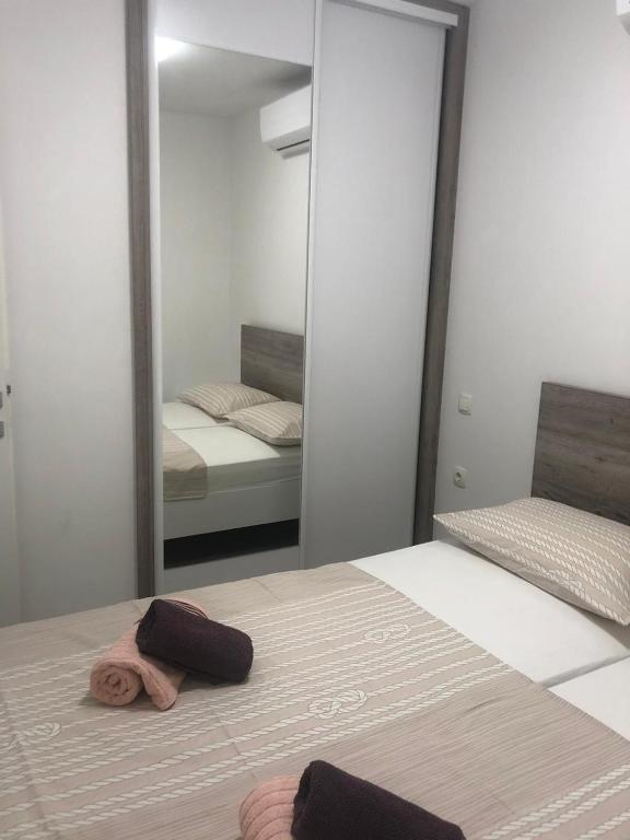 Posteľ alebo postele v izbe v ubytovaní Apartman Lea Makarska