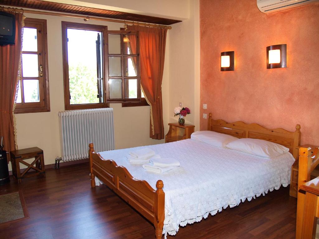 Postel nebo postele na pokoji v ubytování Olga Studios