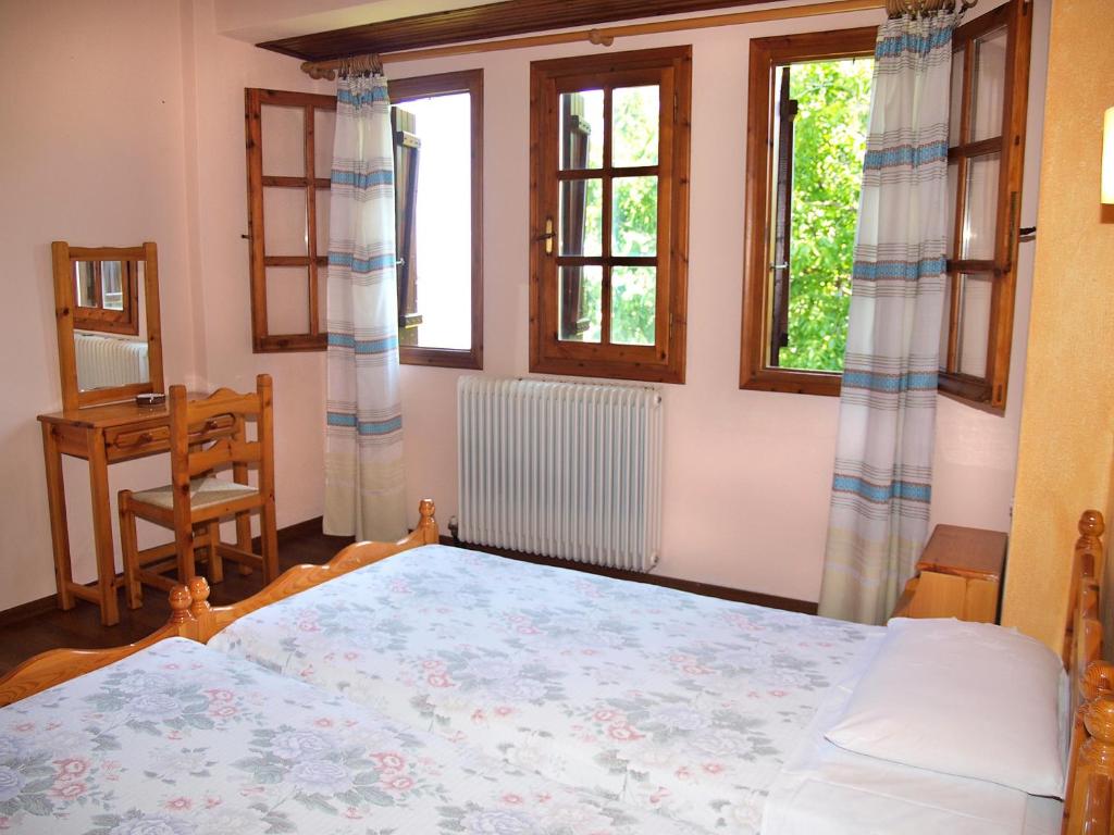 Postel nebo postele na pokoji v ubytování Olga Studios