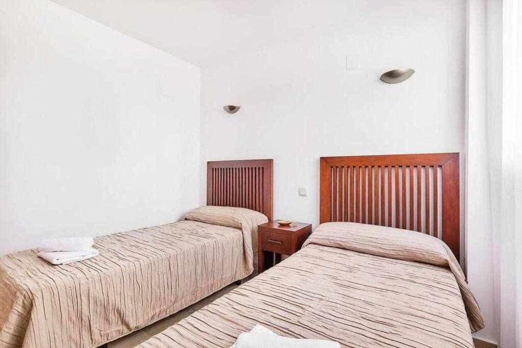 Postel nebo postele na pokoji v ubytování Espanhouse Linda apartment