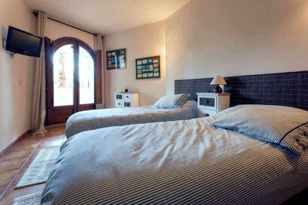 Postel nebo postele na pokoji v ubytování Espanhouse Manhattan