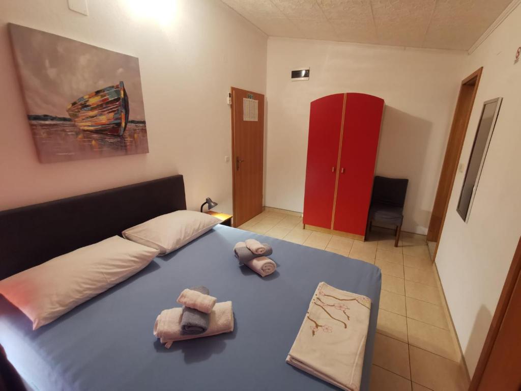 Posteľ alebo postele v izbe v ubytovaní Mali Lovre