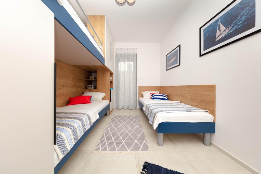 Postel nebo postele na pokoji v ubytování Apartman Oranž