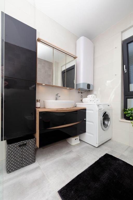 Kuchyň nebo kuchyňský kout v ubytování Apartman Oranž