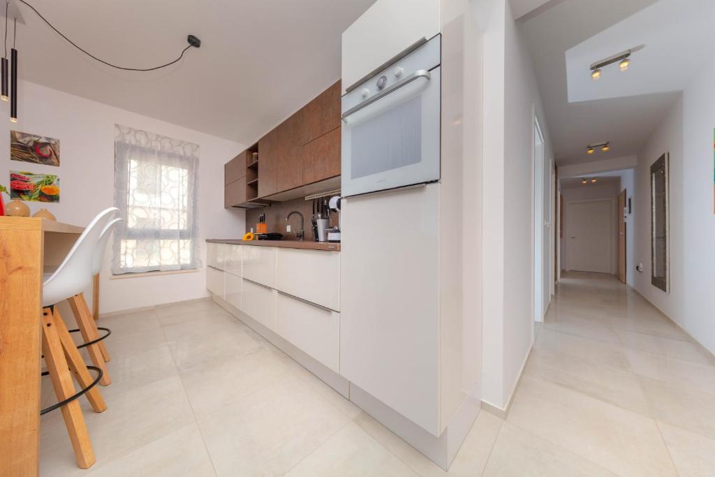 Kuchyň nebo kuchyňský kout v ubytování Apartman Oranž