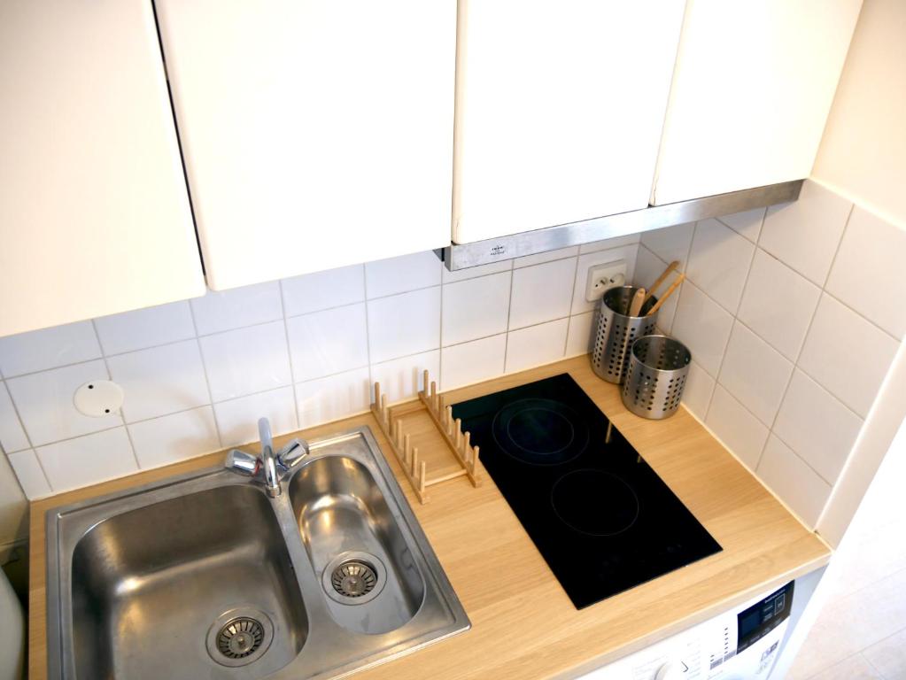 Kuchyňa alebo kuchynka v ubytovaní Le Petit Soleil de Corbeil