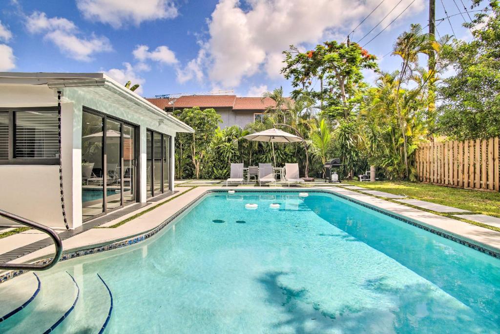 a swimming pool in the backyard of a house at Fort Lauderdale Home Near Shops, Cafes, Beach in Fort Lauderdale