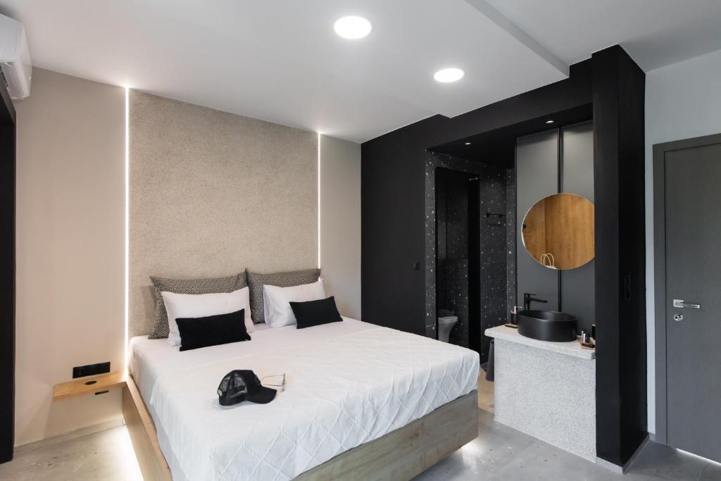 Postel nebo postele na pokoji v ubytování COCO SUITES