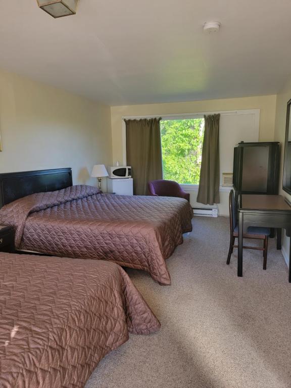 Postel nebo postele na pokoji v ubytování Gateway Motel