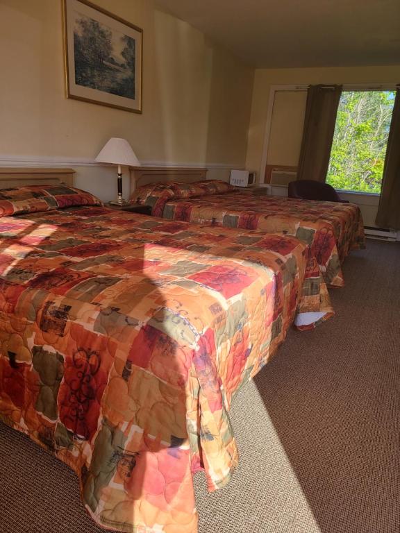 Postel nebo postele na pokoji v ubytování Gateway Motel