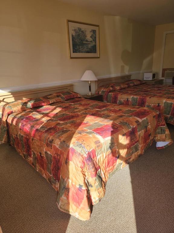 Postel nebo postele na pokoji v ubytování Gateway Motel