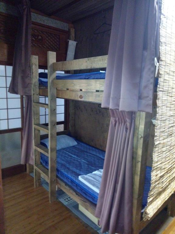 Postel nebo postele na pokoji v ubytování 手広beachbackpackers