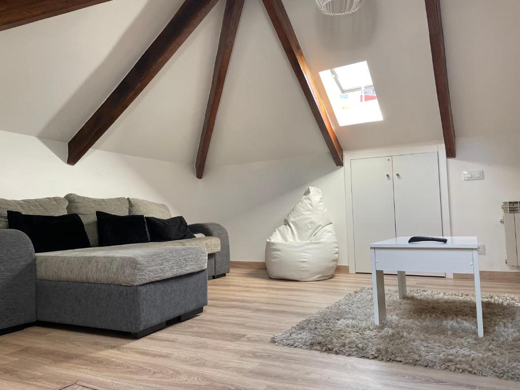 a living room with a couch and a table at Casa España Sol in Vigo